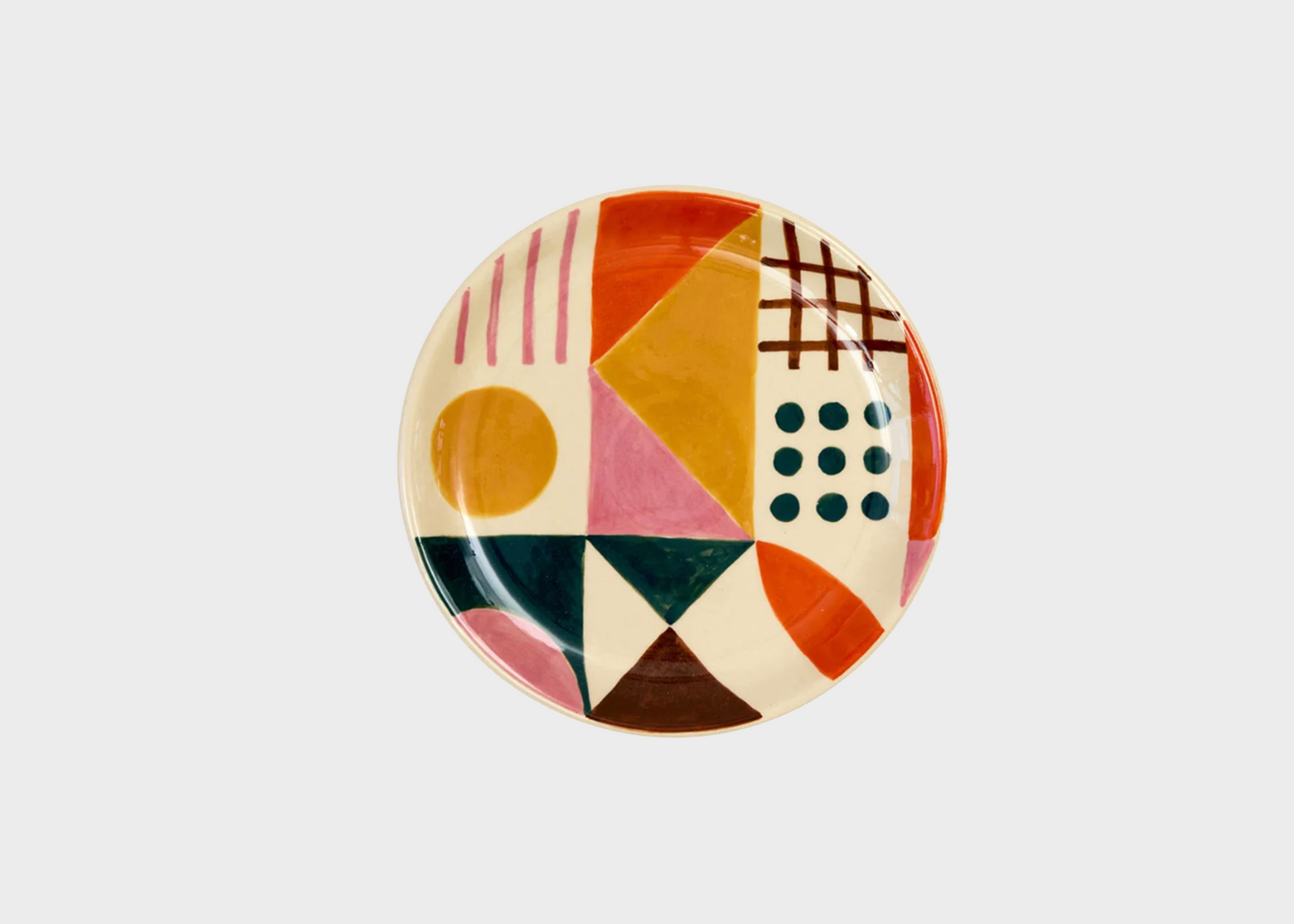 Decorative plate with geometric pattern on a light gray background