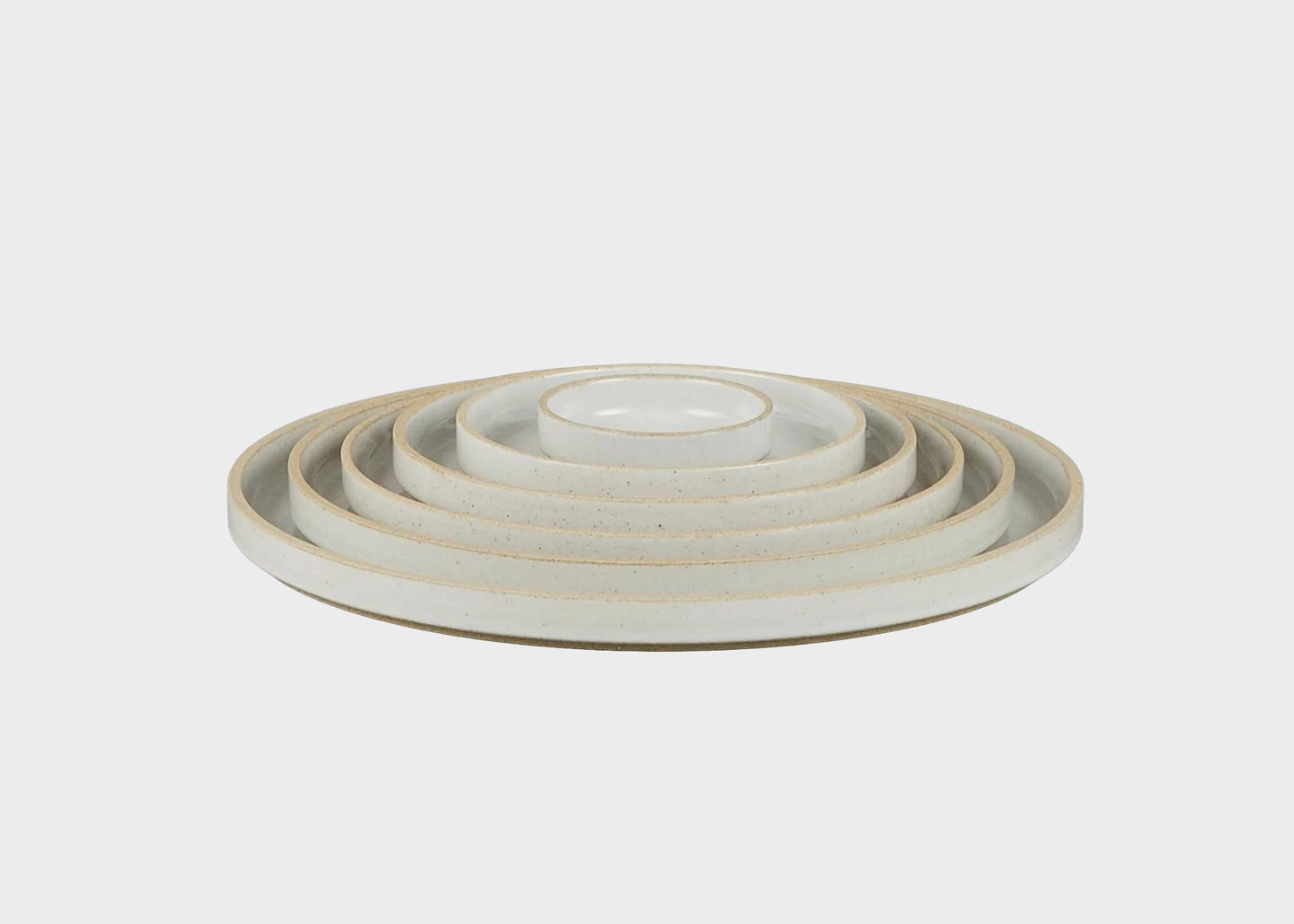 
                  
                    Set of gloss gray Hasami ceramic plates in varying sizes on a light gray background
                  
                