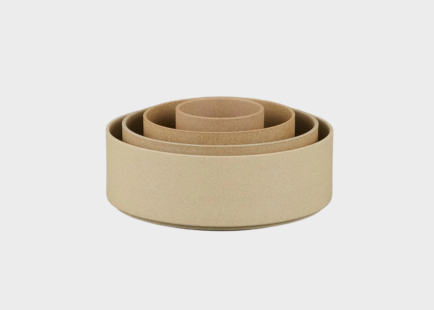 
                  
                    Set of hasami natural bowls of different sizes on a light gray background as sold by Woodland Mod
                  
                