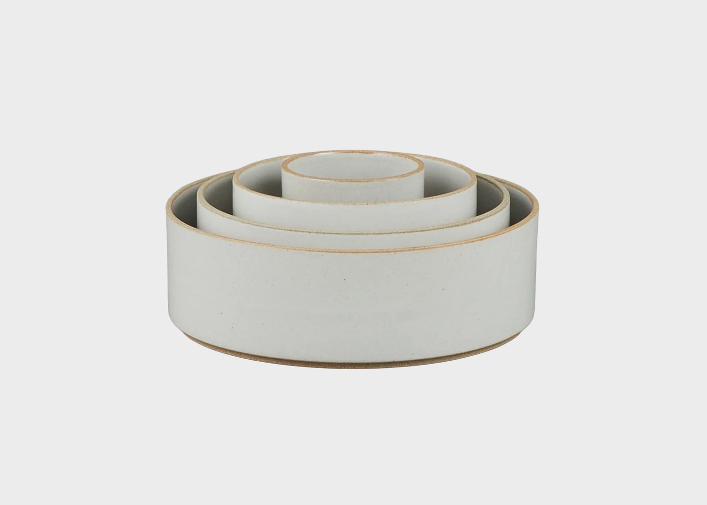 
                  
                    Set of tall gloss gray ceramic bowls with natural rims on a light gray background
                  
                