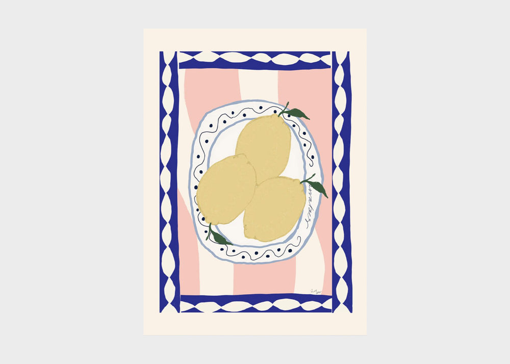 wavy table print with lemons on a plate with a blue border and pink background