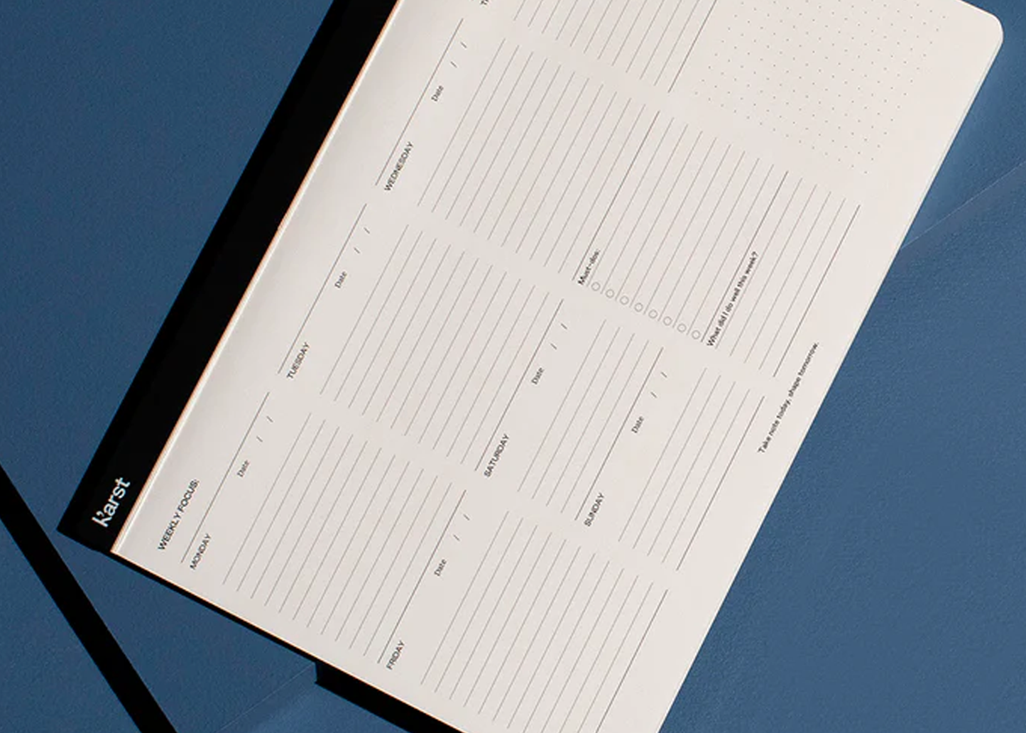 Notebook with a planner layout on a blue background