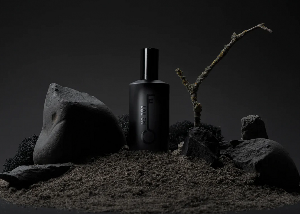 Fischersund perfume scent No. 101 in a 50ml black perfume bottle surrounded by sticks and rocks