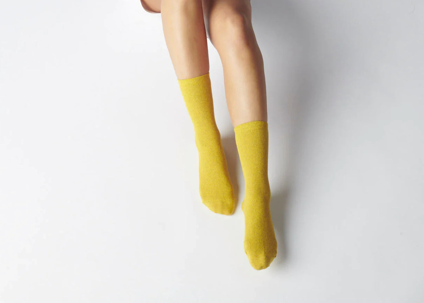 
                  
                    Everyday Cotton Socks in yellow Munsell color by Hooray Sock Co. on legs
                  
                