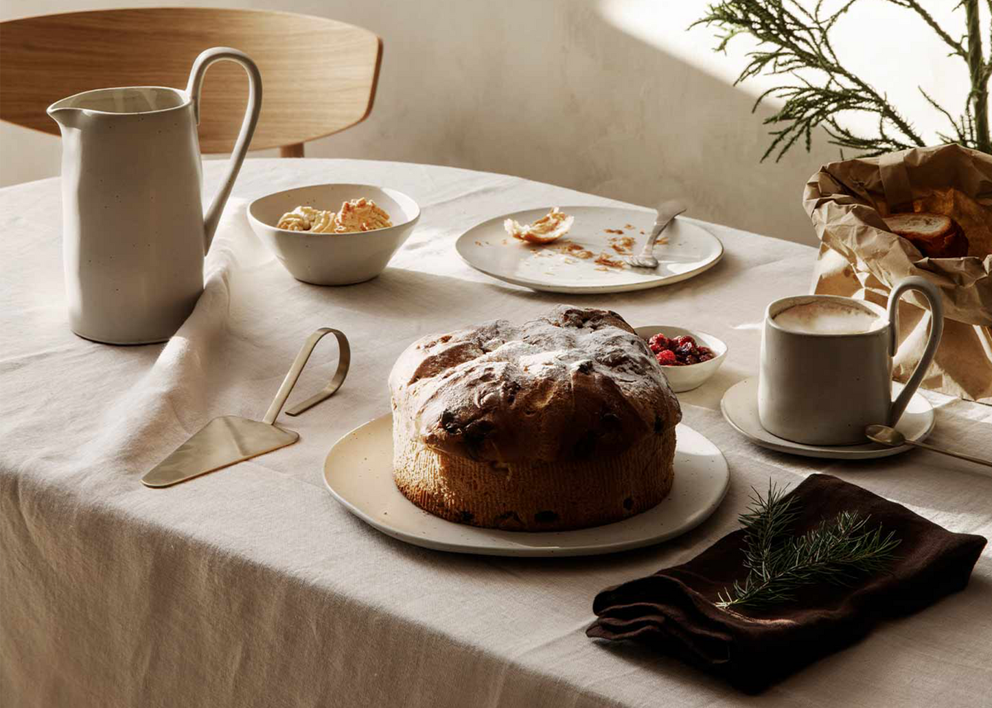 The Fein cake server on a set table with pastries and cake by Ferm Living 