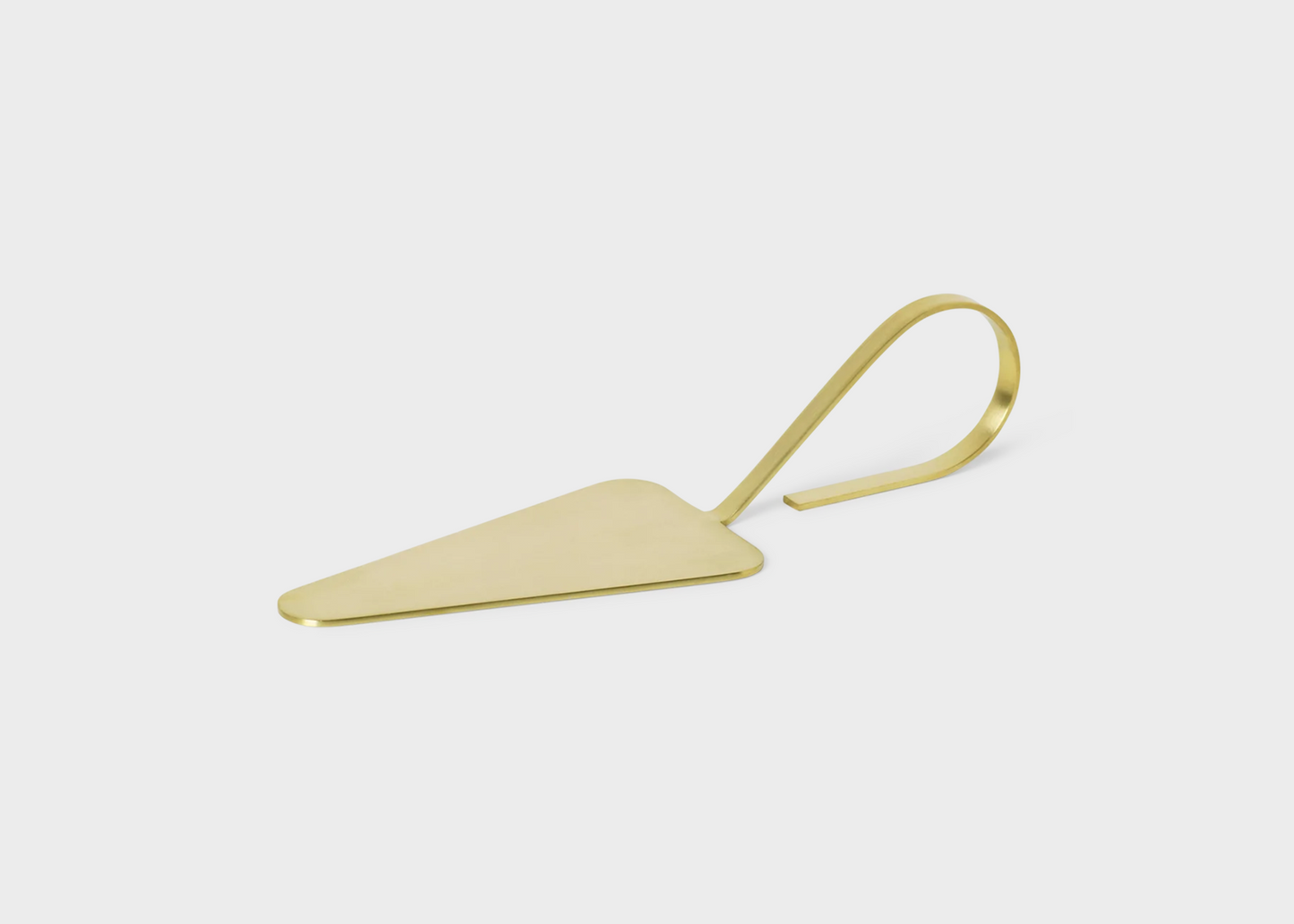 A brass Fein cake server by Ferm Living as sold by Woodland Mod