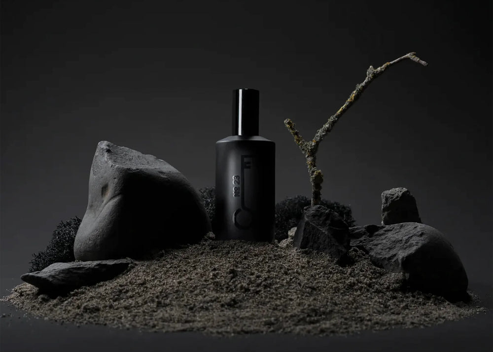 
                  
                    Fischersund perfume scent No. 23 in a 50ml black perfume bottle surrounded by rocks and dirt
                  
                