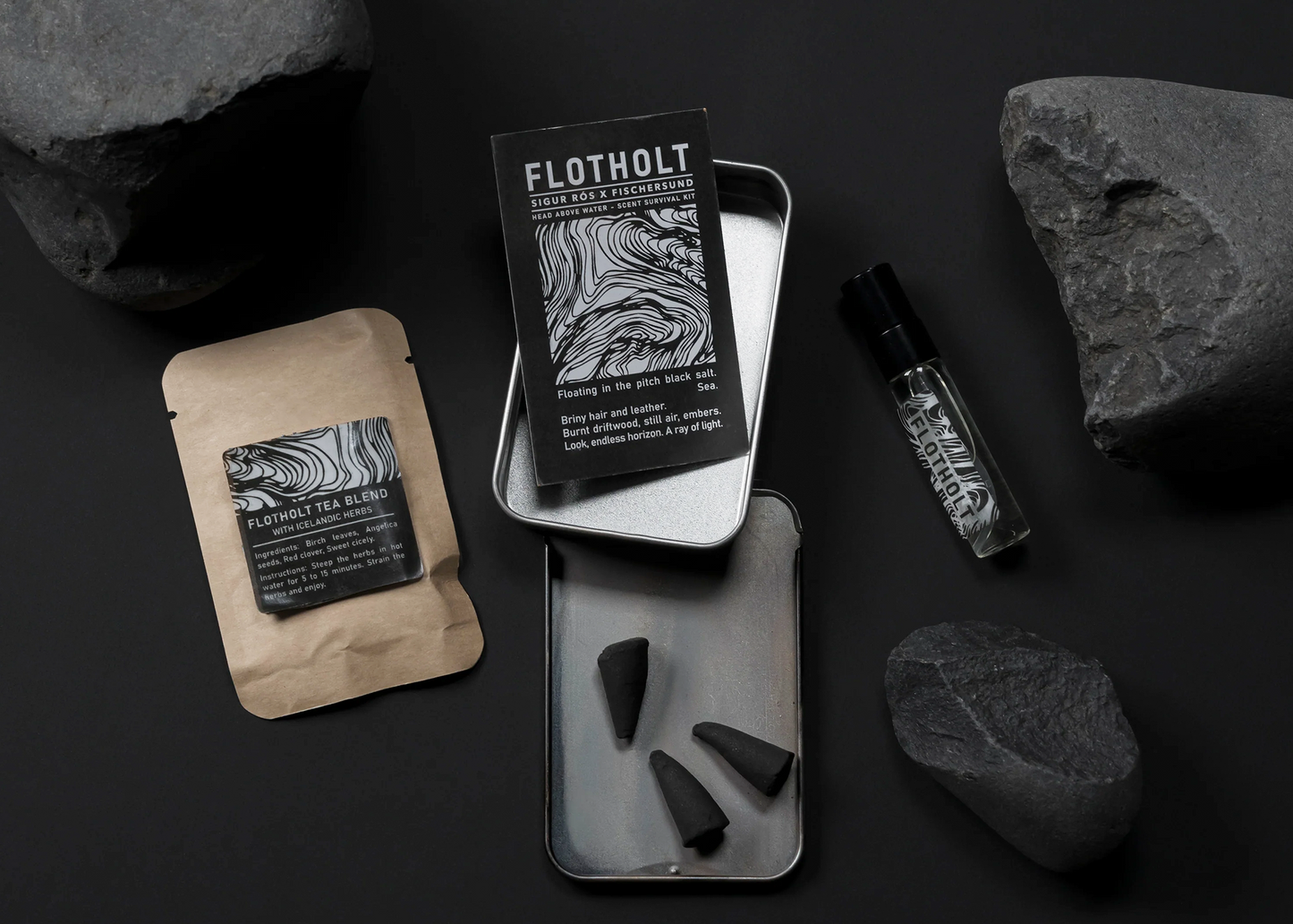 
                  
                    The Flotholt Scent kit by Fischersund with tea, perfume, and incense around lava rocks
                  
                
