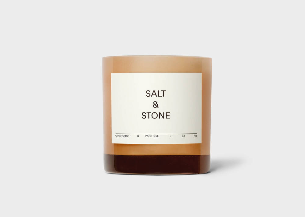 Grapefruit & Patchouli Candle by Salt and Stone with pink glass