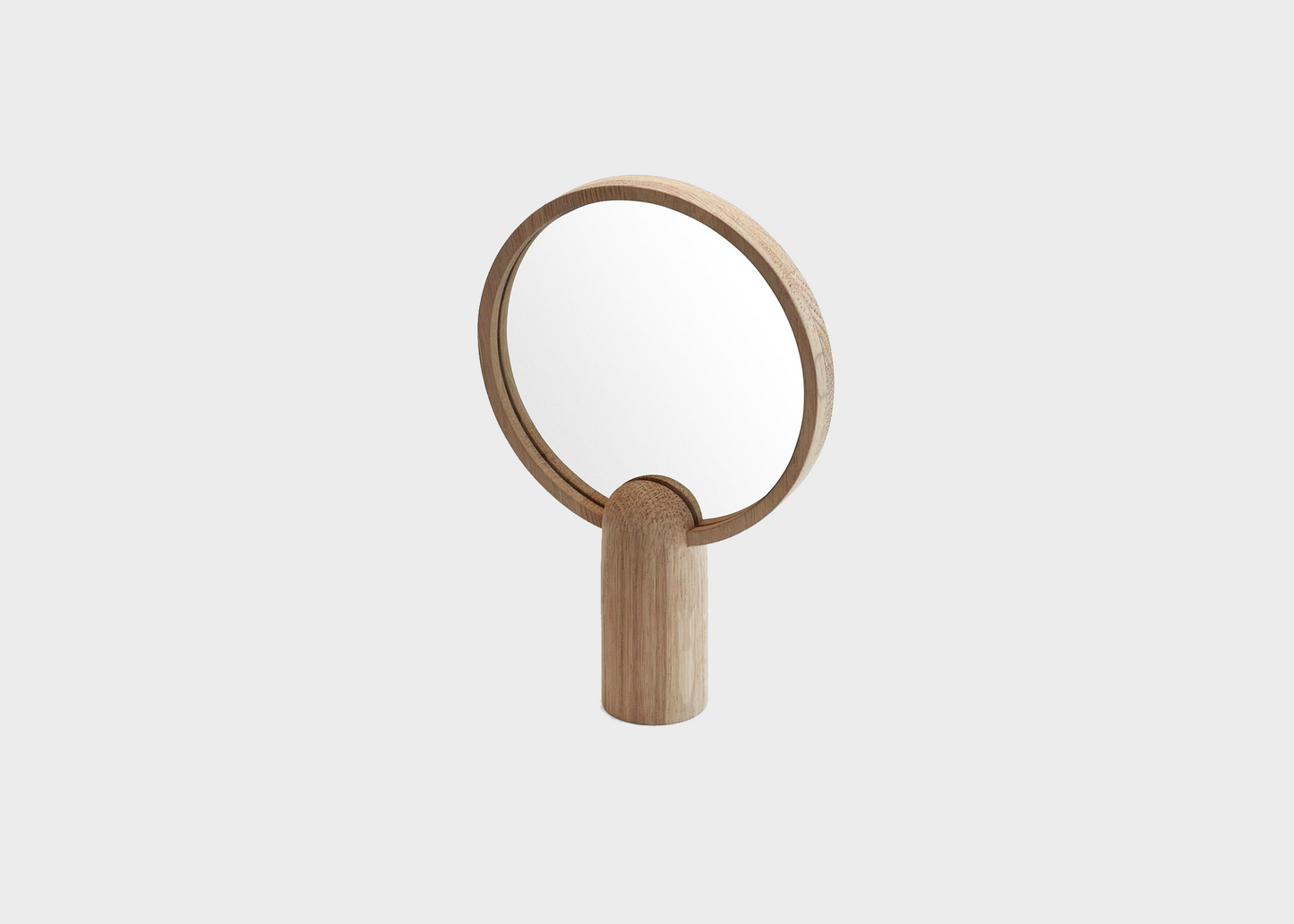 The round handheld small Aino mirror by Skagerak and Fritz Hansen