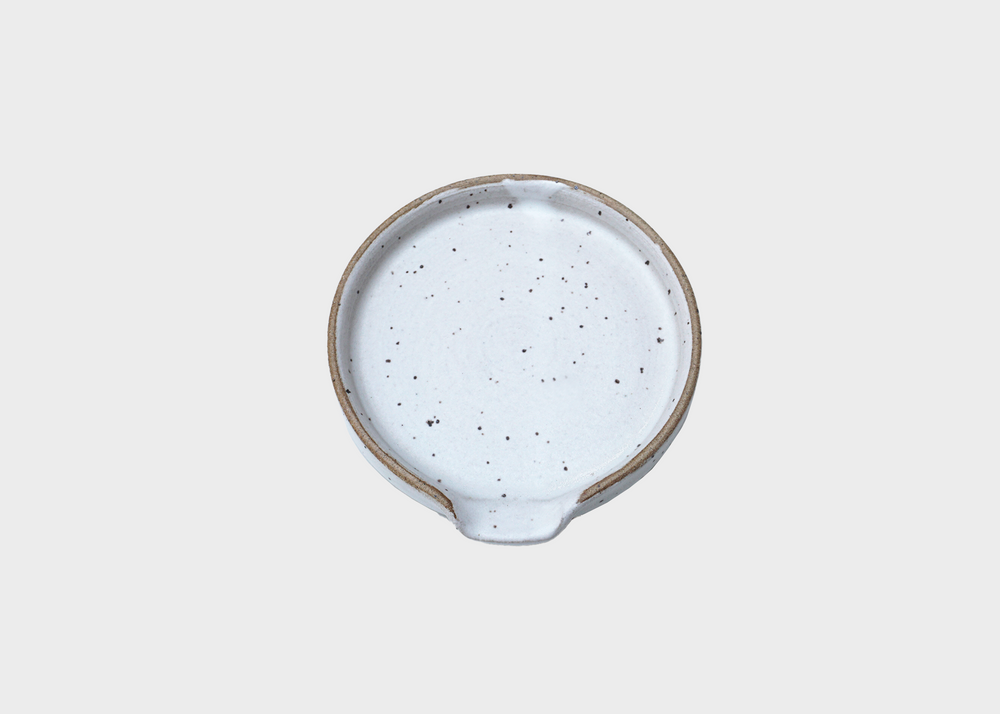 
                  
                    A white speckled ceramic spoon rest by BYUN ceramics as sold by Woodland Mod
                  
                