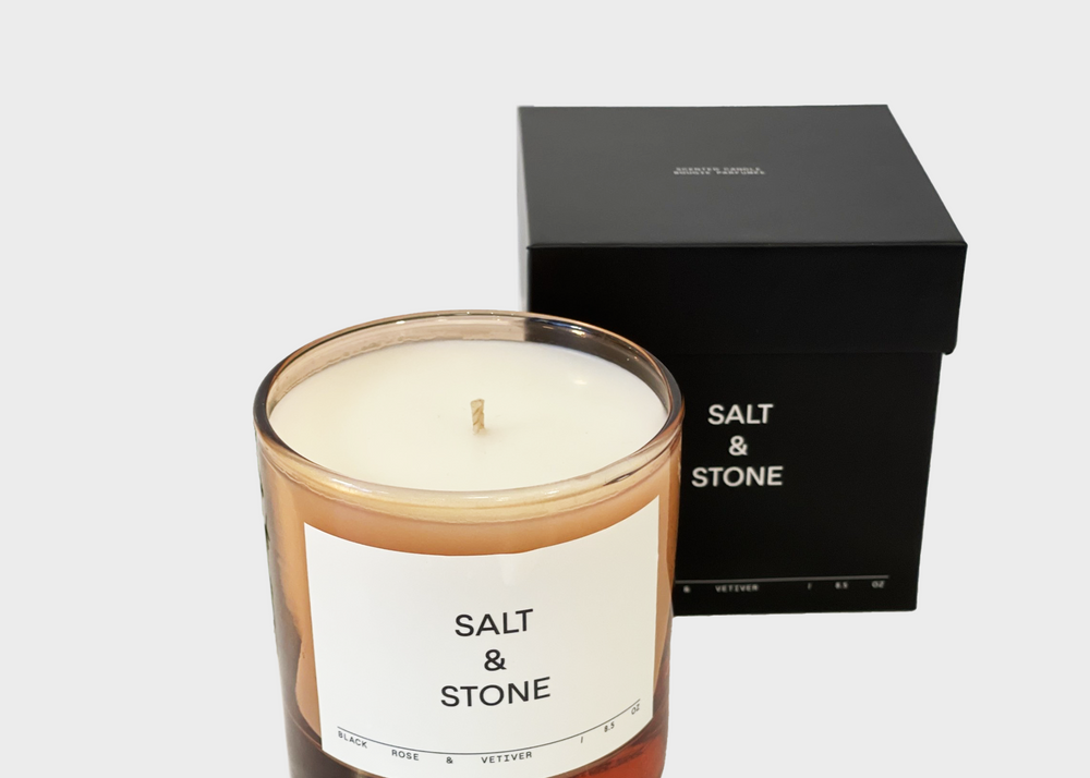 
                  
                    Black Rose & Vetiver Candle by Salt and Stone with pink glass and black box
                  
                