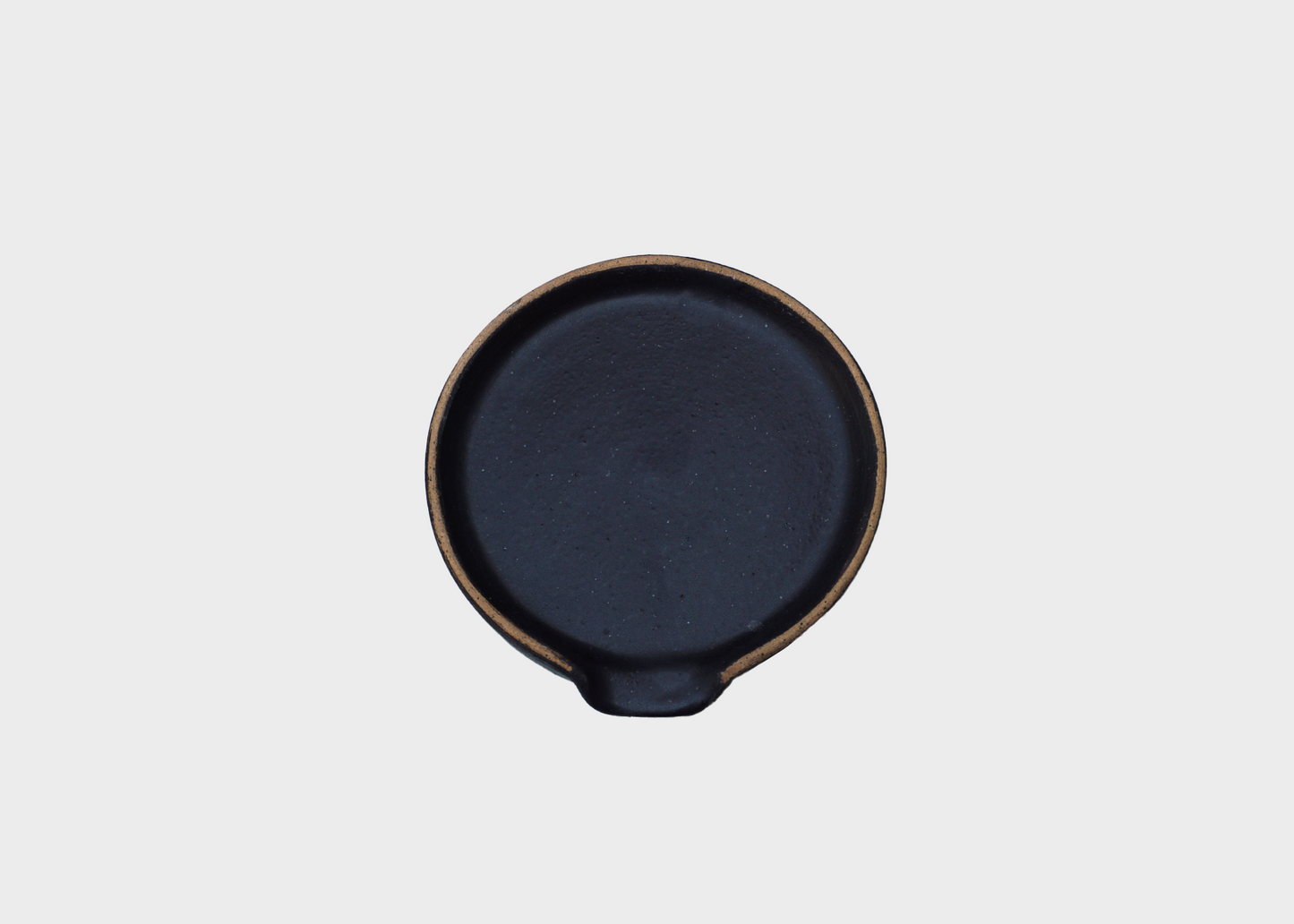 
                  
                    A black ceramic spoon rest by BYUN Ceramics as sold by Woodland Mod
                  
                