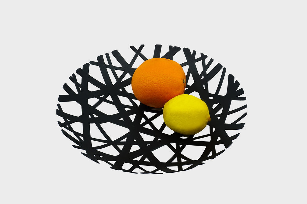 Fruit Bowl - Black Steel by Yamazaki with an orange and lemon in the bowl