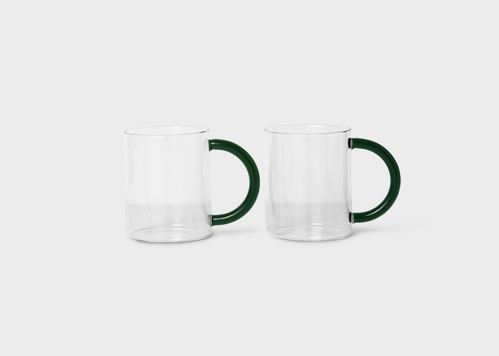 Clear still mugs with dark green handles by Ferm Living