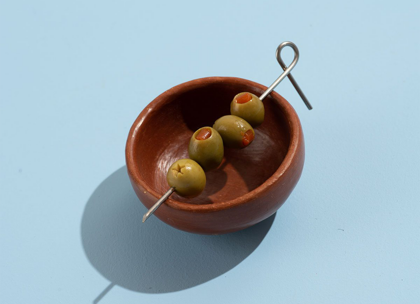 
                  
                    Cocktail Sticks Set by Fruit Super with olives on bowl
                  
                