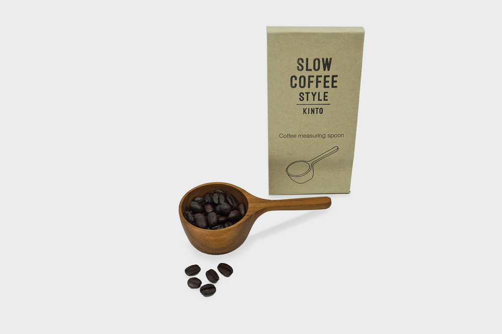 
                  
                    Wooden Coffee Measuring Spoon by Kinto with coffee beans
                  
                