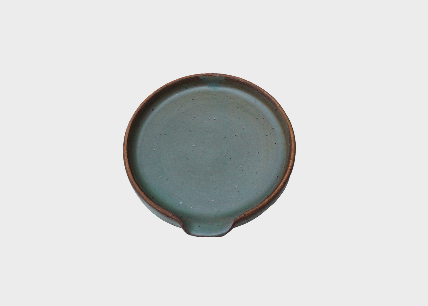 
                  
                    A green ceramic spoon rest by BYUN Ceramics in Portland as sold by Woodland Mod
                  
                