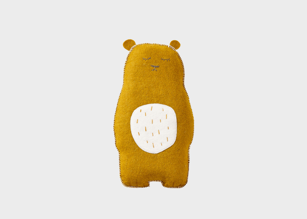
                  
                    A gold teddy bear with a white stomach and closed eyes
                  
                
