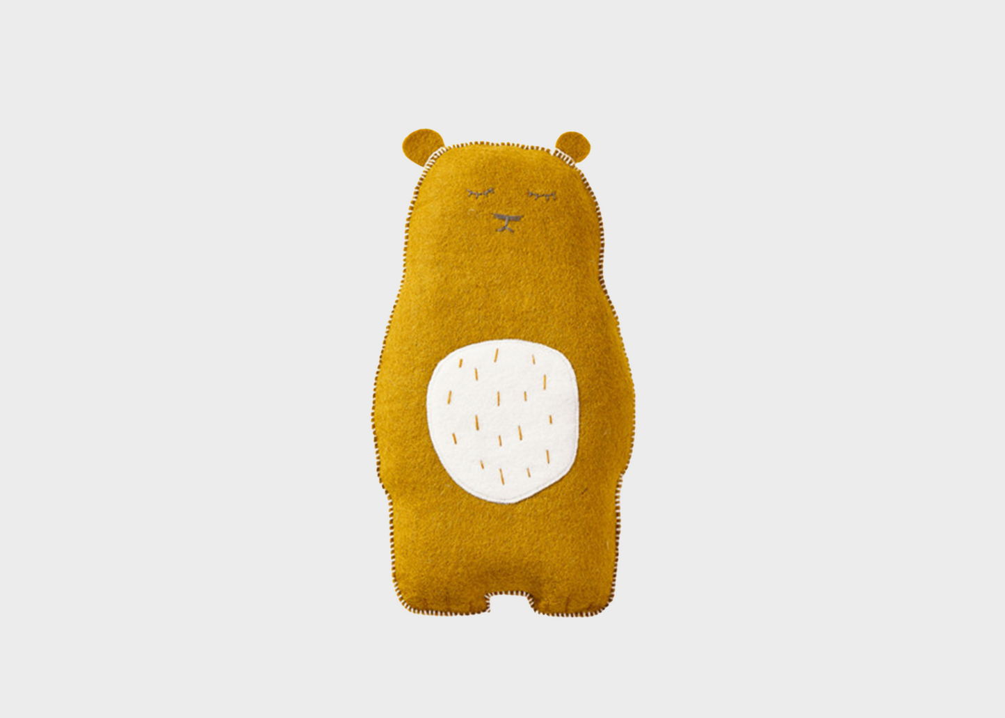 
                  
                    A gold teddy bear with a white stomach and closed eyes
                  
                