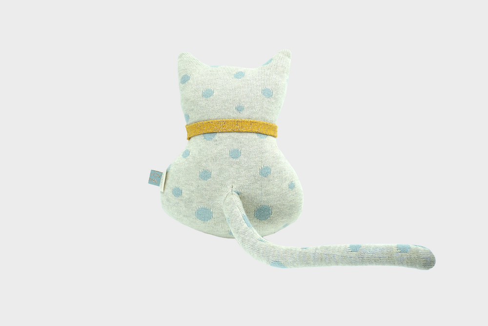 
                  
                    Small polka dotted white cat stuffed animal with yellow collar back side with tail
                  
                