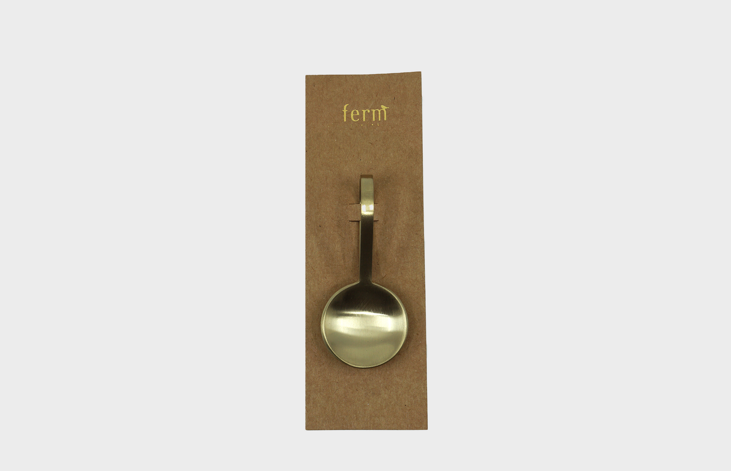 
                  
                    The Fein Sprinkle Spoon in brass by Ferm Living with packaging
                  
                