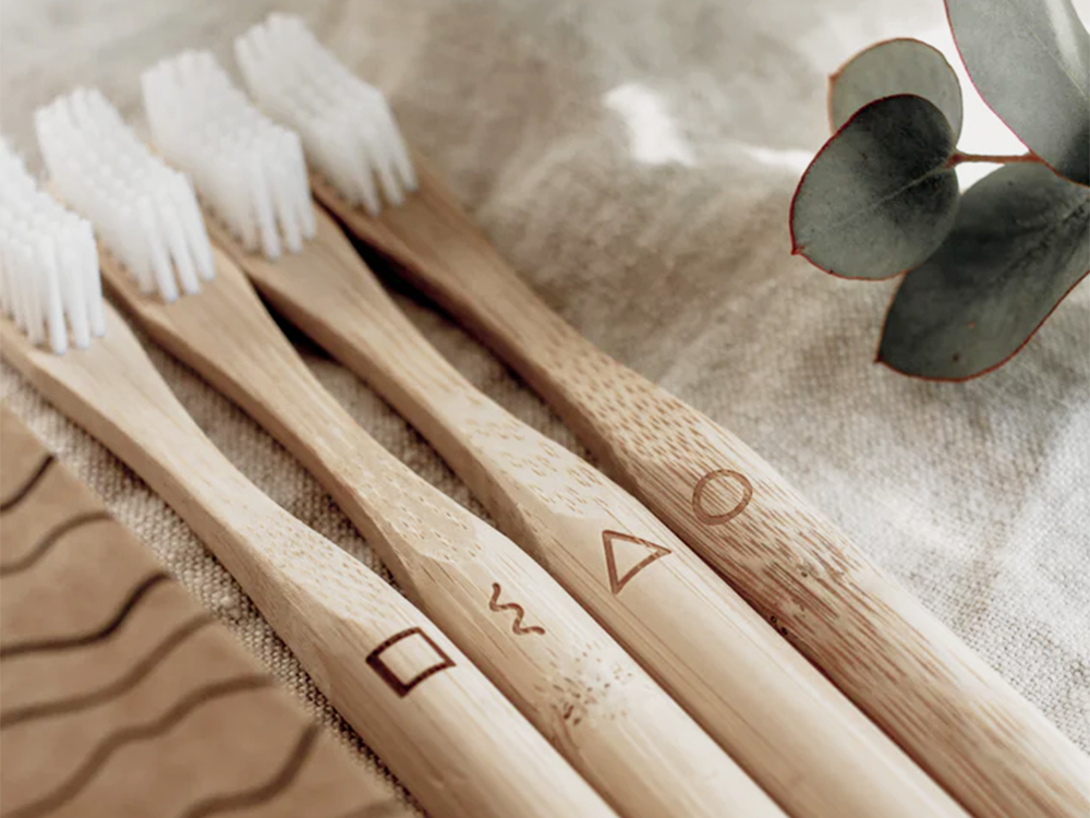 
                  
                    Wooden toothbrushes made of bamboo on a blanket
                  
                
